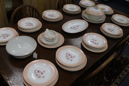 A Limoges Cenpor part dinner service, decorated daises within pink gilt-lined borders, 37 pieces including serving dishes